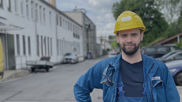 Employee Niklas in front of United Initiators' chemical plant in Pullach, Germany.